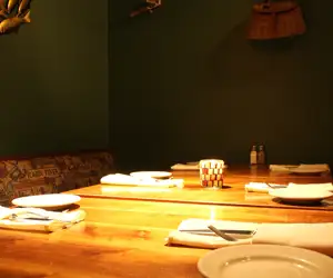 Cozy dining table waiting to be occupied