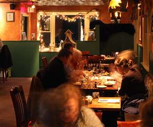 Patrons enjoying a cozy holiday night at the restaurant