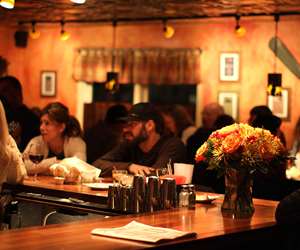 customers sitting at the bar